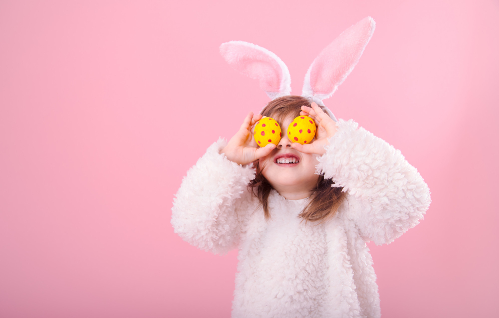 Easter bunny dressed kid with easter eggs